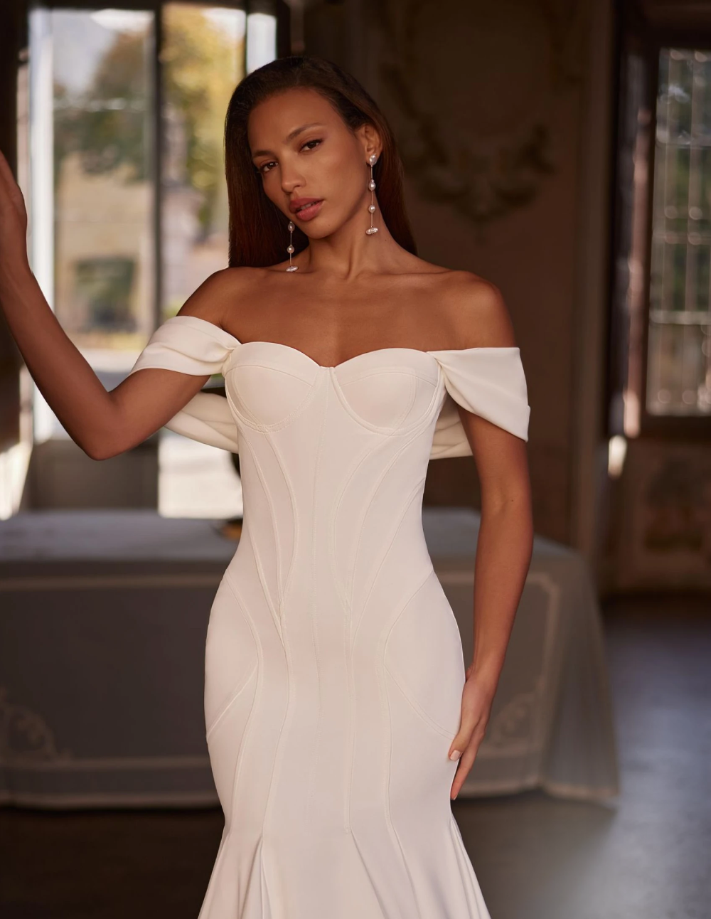Model wearing an white gown