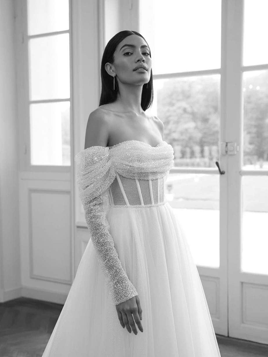 Photo of the model wearing a white gown