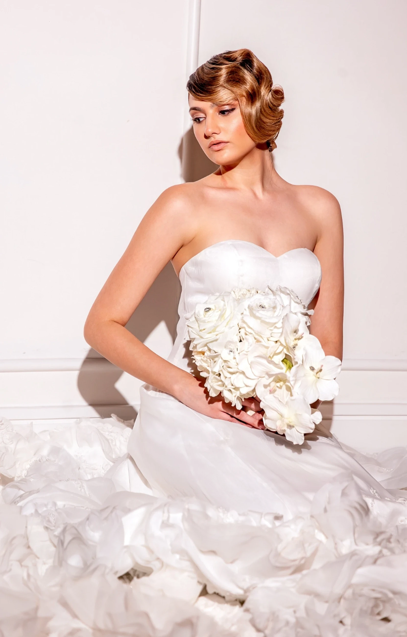 Model wearing a white gown
